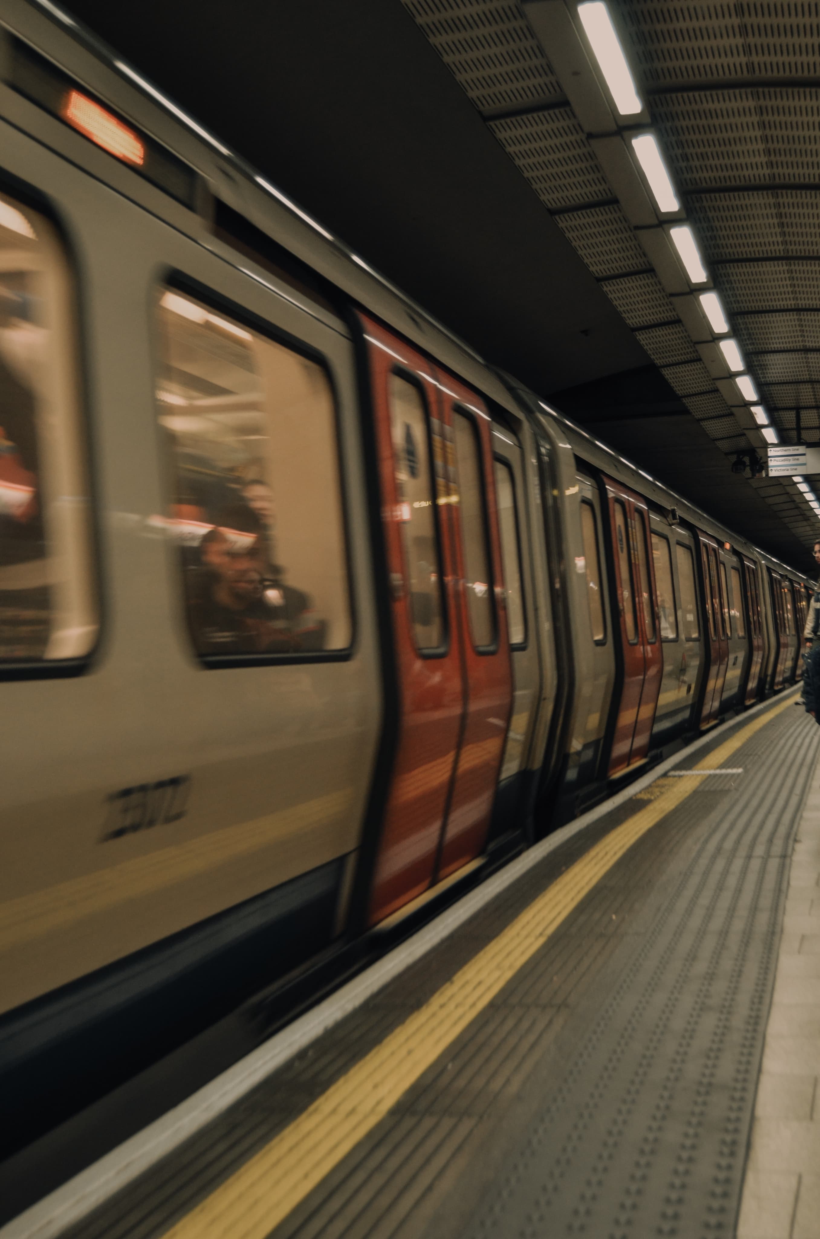 A London Underground train waiting at a platform