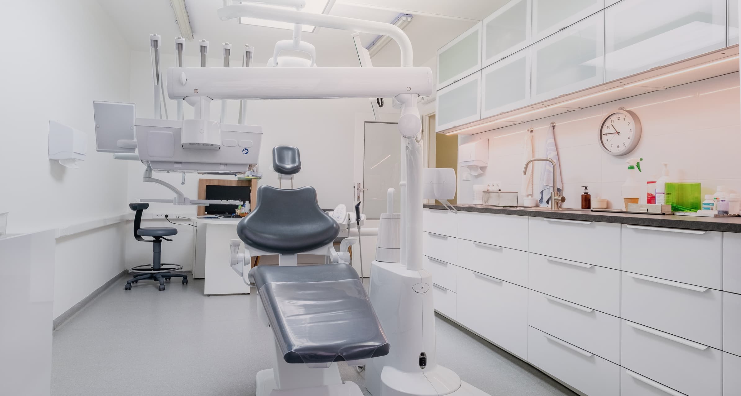 A bright, empty dental surgery with the patient’s chair