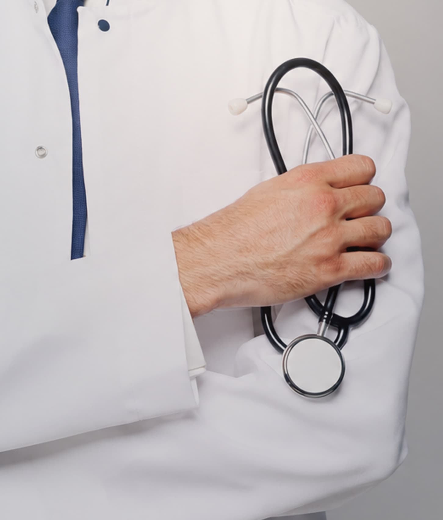 A stethoscope resting on medical paperwork in a doctor’s office